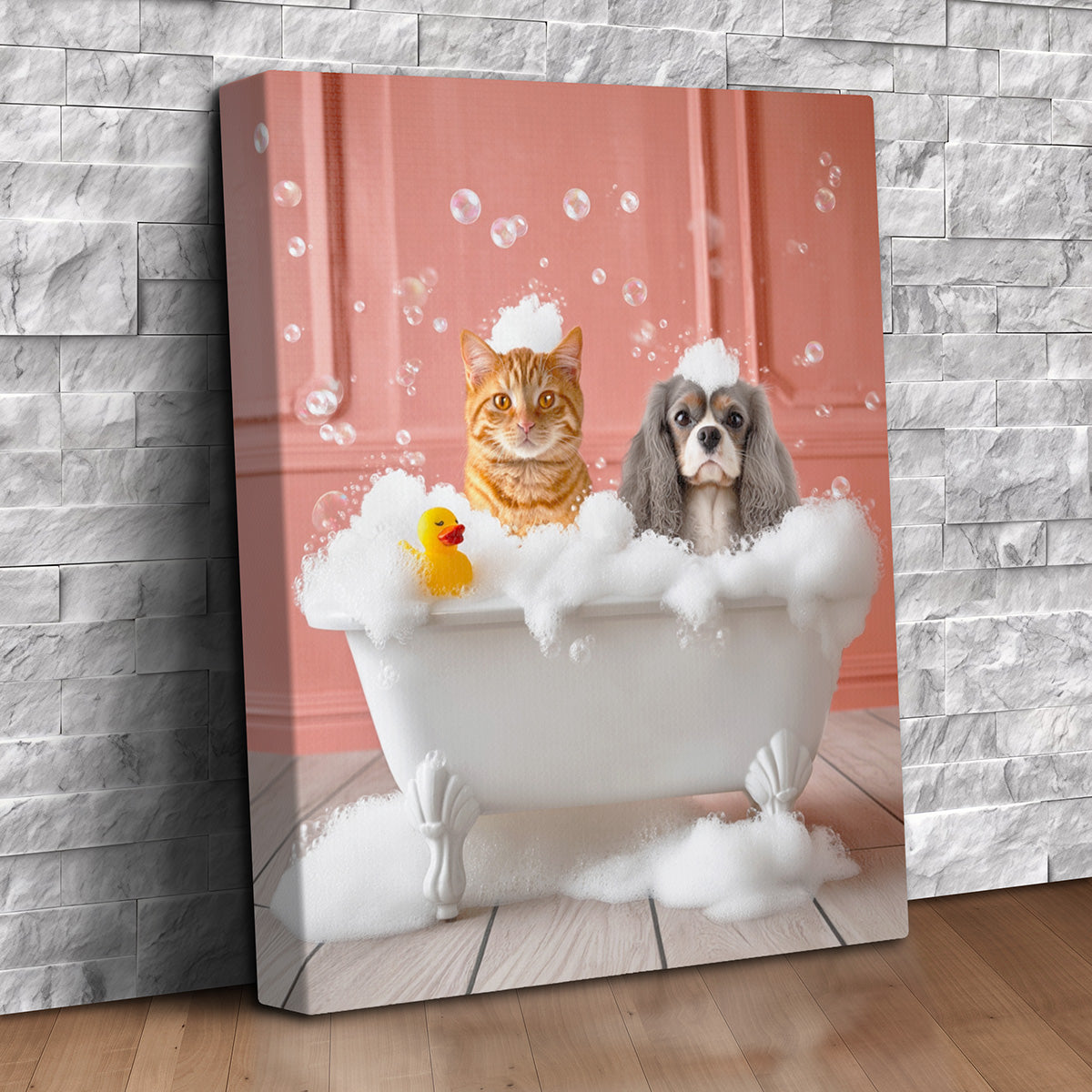 Custom pet portrait canvas of an orange tabby cat and a Cavalier King Charles spaniel in a bubble-filled clawfoot bathtub with a rubber duck against a coral wall